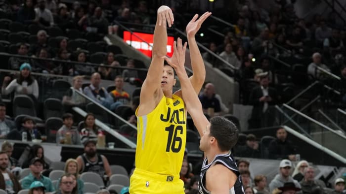 Utah Jazz forward Simone Fontecchio (16) shoots over San Antonio Spurs forward Doug McDermott (17) in the first half at the AT&T Center.